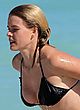 Alice Eve busts out in wet black bikini pics