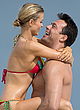 Joanna Krupa petting in a thong bikini pics