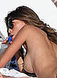 Claudia Galanti naked pics - sunbathing topless on a beach
