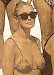 Demi Moore in smeared with mud in bikini pics