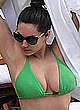 Kelly Brook deep cleavage in green bikini pics