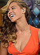 Beyonce Knowles in orange dress at radio row pics
