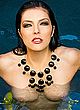 Adrianne Curry flashes her bare tits in pool pics