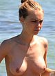 Katharina Damm sunbathing topless on a beach pics