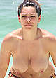Kelly Brook sunbathing & swimming topless pics