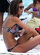 Audrina Patridge sunbathing in bikini on beach pics