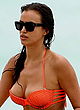 Irina Shayk near nip slip in orange bikini pics