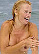 Pamela Anderson goes topless on a beach pics