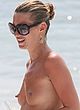 Kate Moss tanning topless on a beach pics