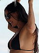 Demi Moore shows sideboob in black bikini pics