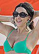 Claudia Romani in green bikini on a beach pics