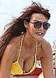 Lizzie Cundy in yellow bikini on a boat pics