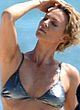 Charlize Theron in sexy swimsuit on a beach pics