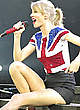 Taylor Swift shows long legs on a stage pics