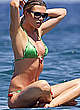 Abigail Clancy paddleboarding in green bikini pics