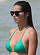 Adriana Lima in green bikini on a beach pics