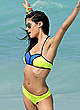 Sara Sampaio in yellow bikini on a beach pics