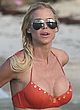 Victoria Silvstedt nipple-slip in orange bikini pics