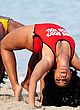 Angela Simmons doing a bridge in red swimsuit pics