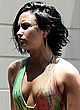 Demi Lovato getts wet in low cut swimsuit pics