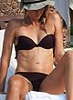 Maria Sharapova tanning in black bikini pics