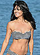 Brooke Burke in a bikini on a beach pics