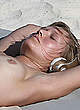 Toni Garrn sunbathing topless in miami pics