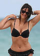 Claudia Romani in black bikini on a beach pics