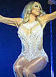 Mariah Carey performing on a stage pics