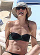 Maria Sharapova in dark bikini on a beach pics