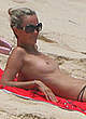 Laeticia Hallyday naked pics - sunbathing topless on a beach