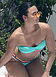 Demi Lovato sunbathing in blue bikini pics