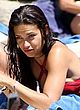 Adriana Lima sunbathing in sexy red bikini pics