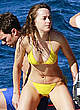 Dakota Johnson in yellow bikini on a yacht pics