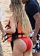 Khloe Kardashian caught in wet red swimsuit pics