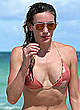 Katie Cassidy wearing a bikini at a beach pics