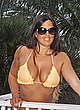 Claudia Romani in yellow bikini poolside pics