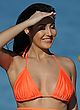 Chloe Goodman paddling in hot orange bikini pics