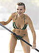 Joanna Krupa paddleboarding in green bikini pics