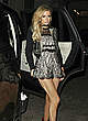 Paris Hilton in short dress shows her legs pics