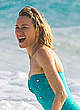Naomi Watts in green swimsuit on a beach pics