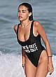 Madison Beer in black swimsuit on a beach pics