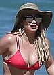 Hilary Duff busty and booty in red bikini pics