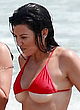 Kourtney Kardashian shows underboobs in red bikini pics