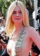 Elle Fanning shows side-boob & big cleavage pics