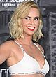 Charlize Theron busty in bra-top & mini skirt pics