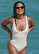 Christina Milian in white swimsuit on a beach pics