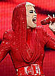 Katy Perry in red performs at a stage pics