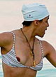 Michelle Rodriguez nipple-slip in striped bikini pics