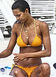 Lais Ribeiro sunbathing in orange bikini pics